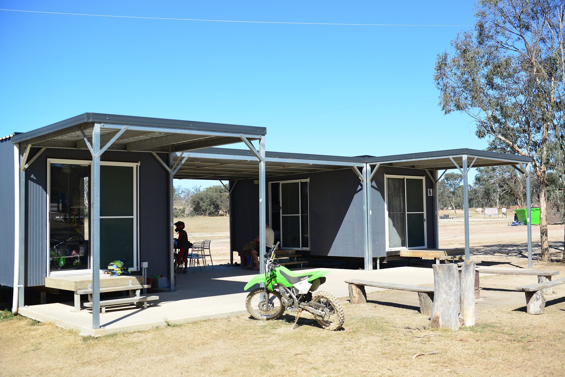 Cabins at Glendon with a motorbike parked out front